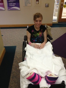 Brittany after a surgery- 6 weeks in leg casts, then 6 weeks in boots, and still smiling!